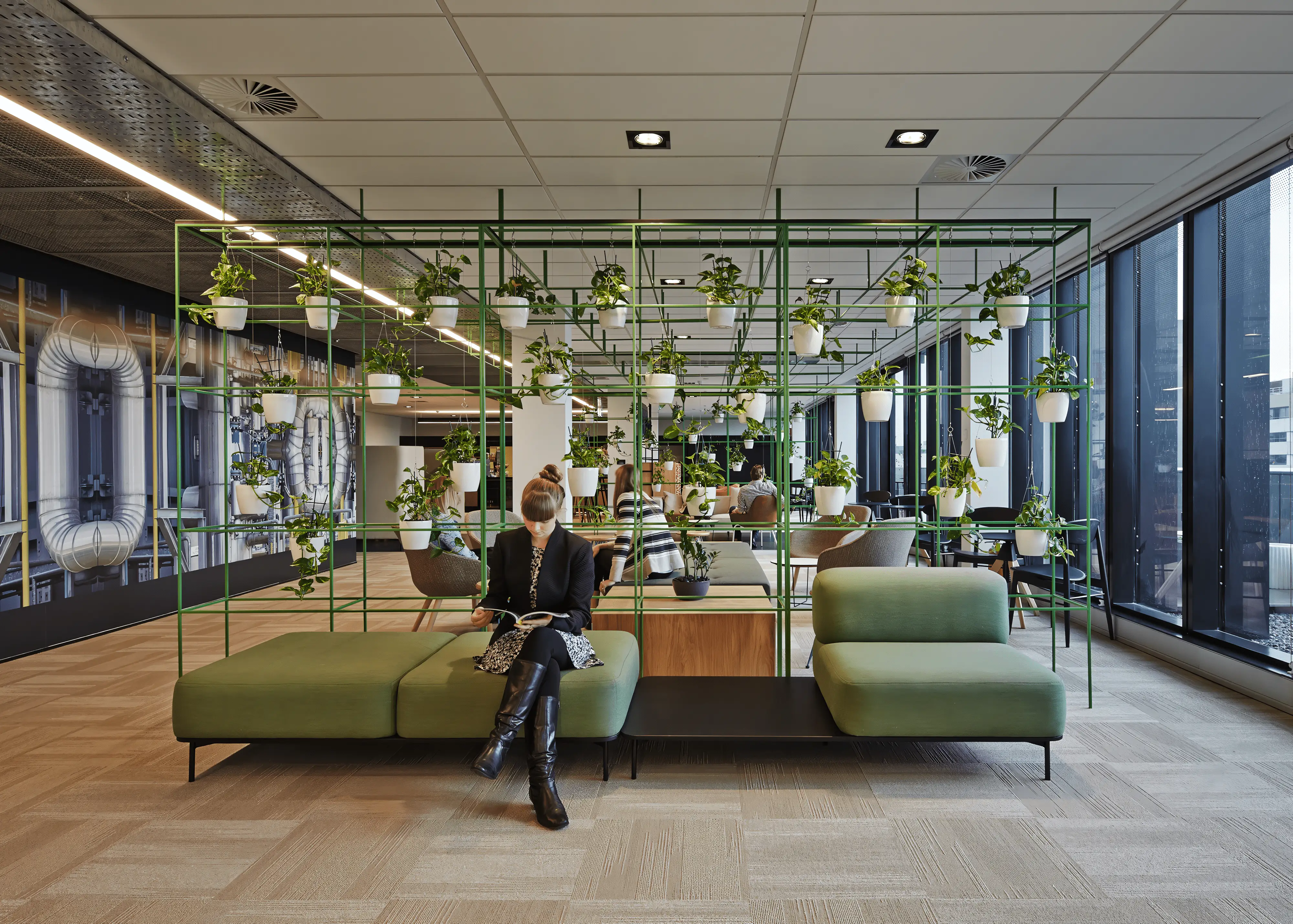 Aurecon Perth Office employees sitting on the Softscape Ottoman by Helen Kontouris